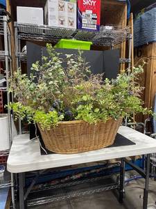 lot 3031 image: Large wicker basket with faux floral arrangement