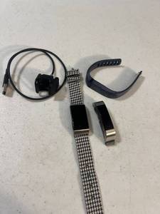 lot 3068 image: 3 Fitbits and a charger