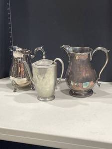 lot 4039 image: Silverplated pitchers (3)