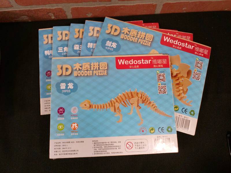 lot 33 image: Wedostar 3D Wooden Dinosaur Puzzle