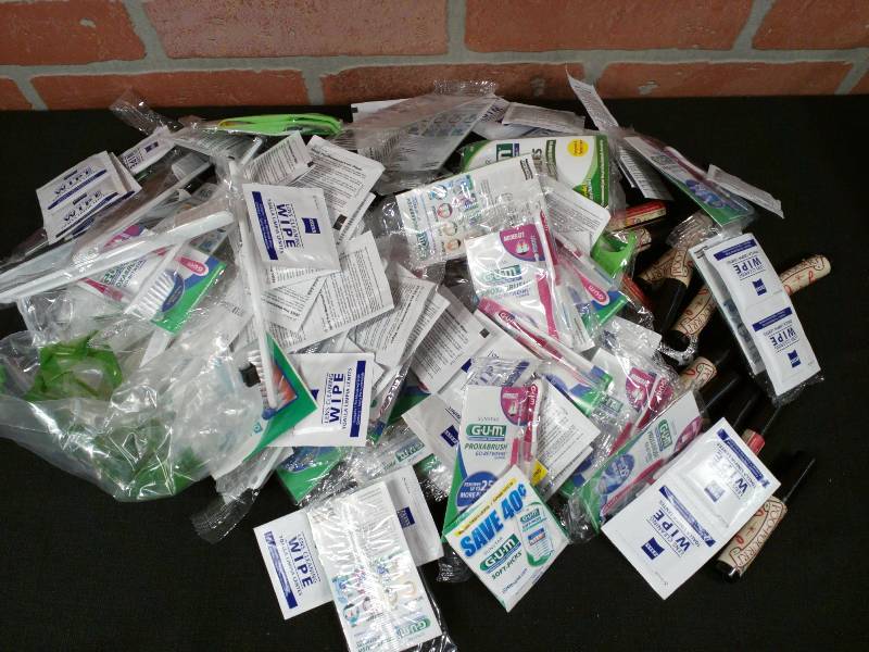 lot 64 image: Hygiene Lot Toothbrushes , Lens Wipes, Poo Pouri, Flossers