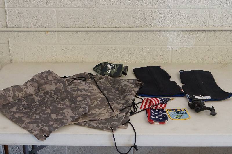 lot 606 image: Camo Backpacks- Knee Braces- Patches-Etc