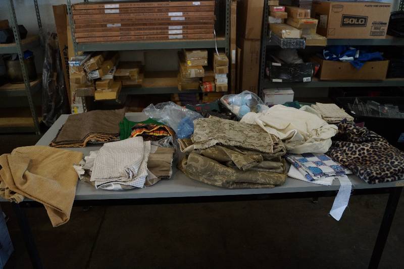 lot 618 image: Table Full of Fabric- Sewing Quilting