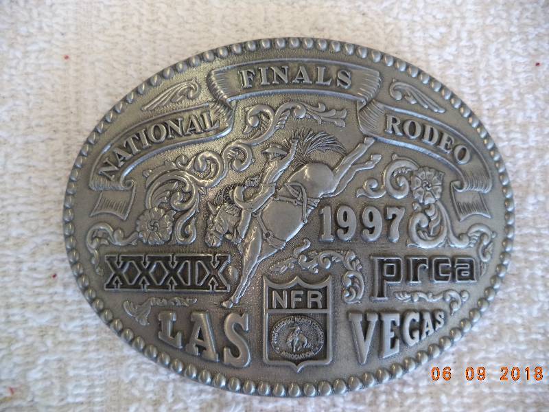 lot 1064 image: 1997 NFR  Rodeo Belt Buckle