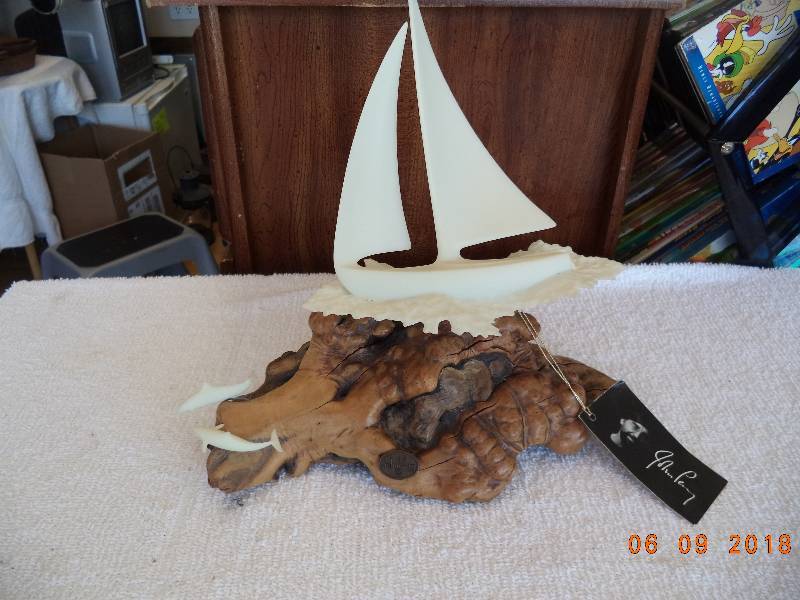 lot 1095 image: JOHN PERRY STUDIOS BURL WOOD SCULPTURE U.S.A.- Sailboat-Dolphins
