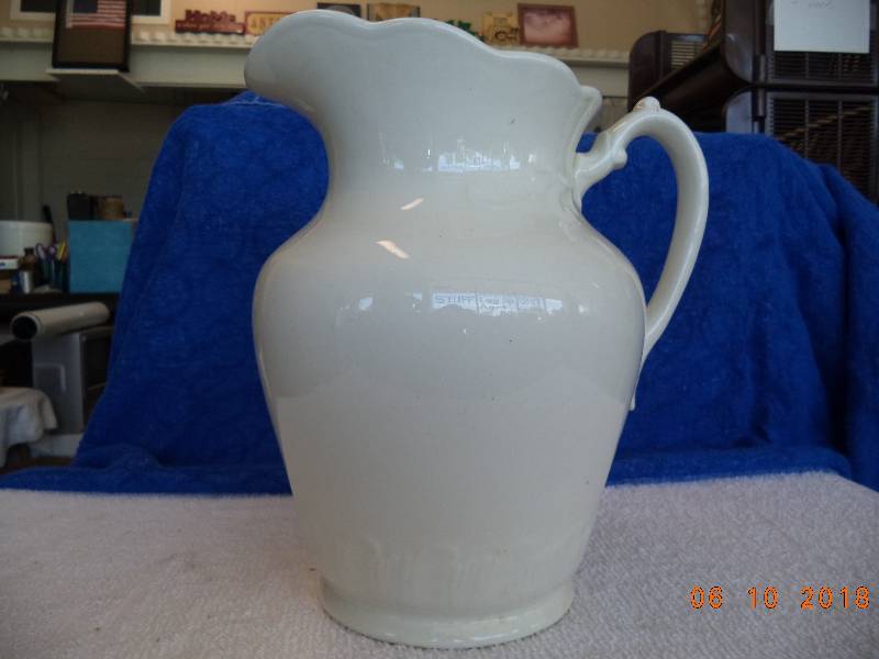 lot 1101 image: 11 Ceramic Pitcher