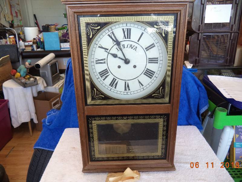 lot 1226 image: Bulova Wall Clock-  Wood