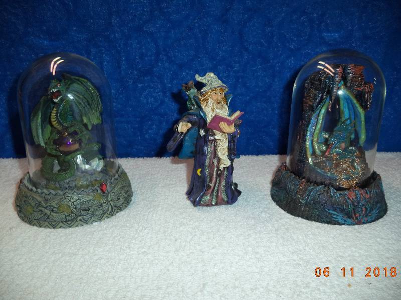 lot 2288 image: 2 Encased Snowglobe Style Dragons and a Sorceror Figure