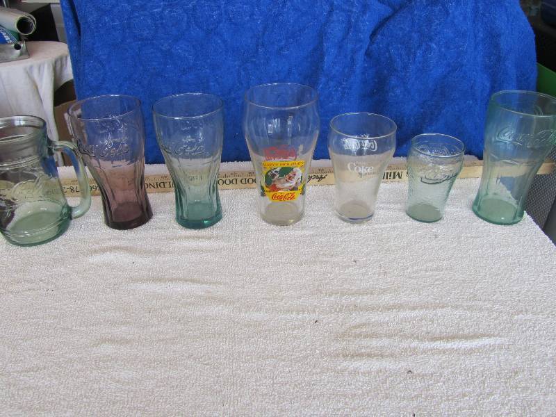 lot 558 image: 7 Coca Cola Glasses  1 Plastic In This Random Collectors Lot