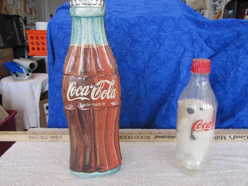 lot 563 image: Coca Cola Metal Bottle AND Polar Bear Inside Plastic Bottle