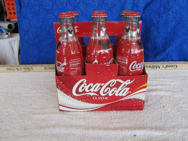lot 565 image: 6 Pack Coca Cola Mickey Mouse Bottles