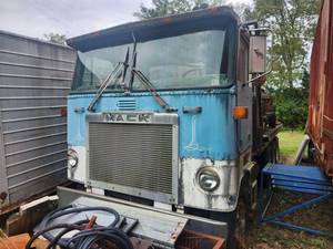 lot 4234 image: Mack Truck Cab and Vintage Truck on Trailer Included