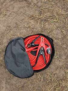 lot 7889 image: Unused&nbsp4 Gauge 25 Foot Jumper Cables with Storage Case