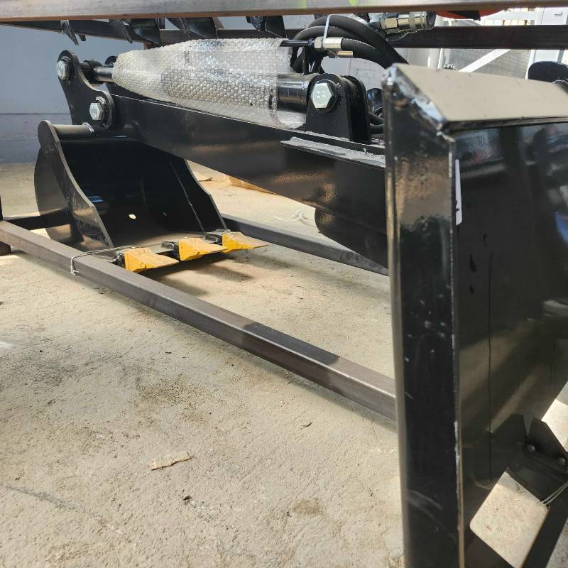 lot 7020 image: Unused Hydraulic Skid Steer Backhoe Arm Attachment