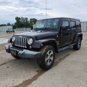 lot 25 image: 2017 Jeep Wrangler Unlimited Sahara  4-Door  59,278 Miles  Black Exterior
