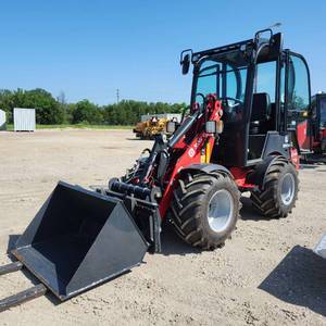 lot 17 image: KX XW15 8150 Compact Wheel Loader with Forks and Bucket Attachment
