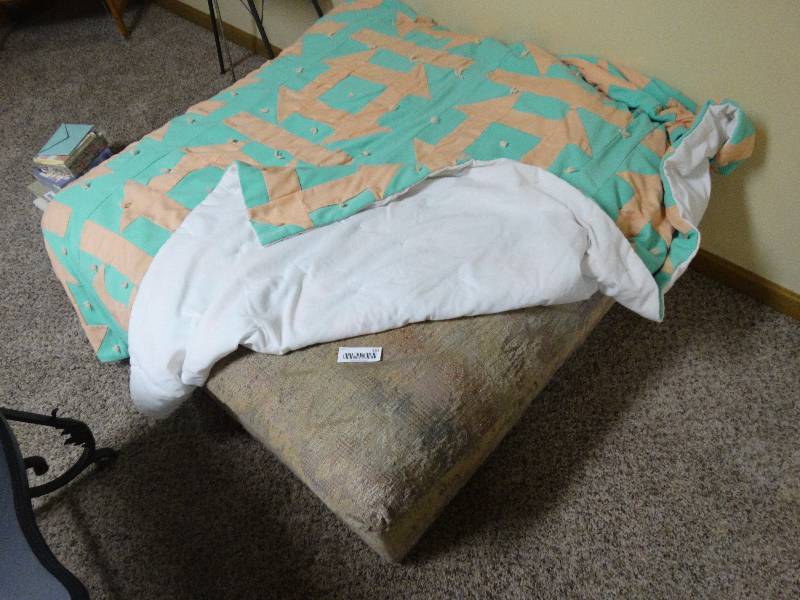 lot 357 image: Large ottoman & quilt