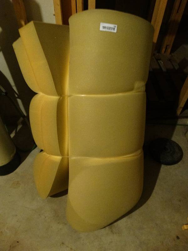 lot 398 image: Roll of memory foam & weights