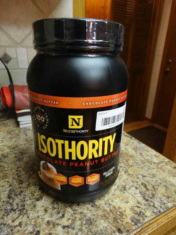 lot 115 image: 2 lb unopened container of Isothority chocolate peanut butter whey protein