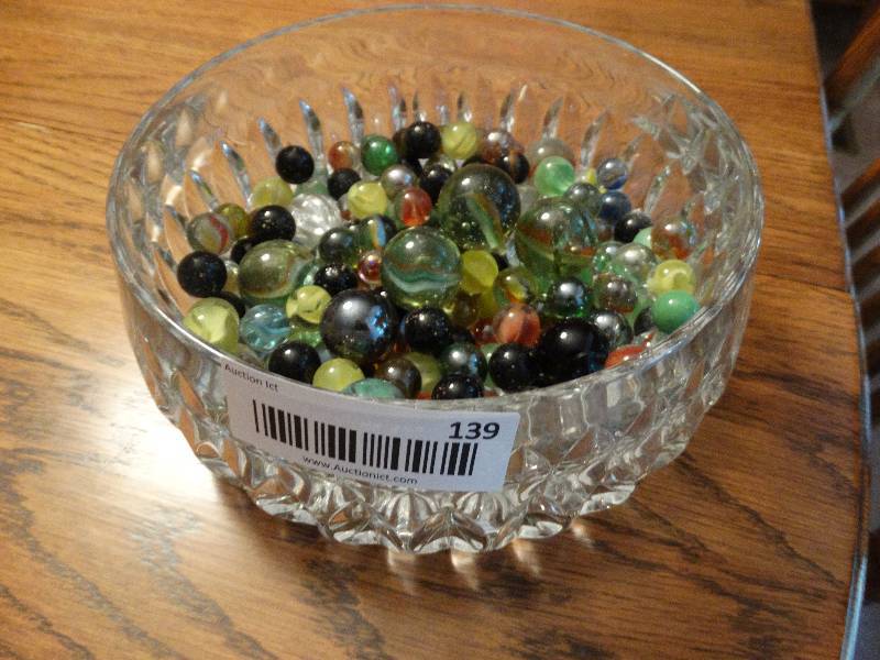 lot 139 image: Cut glass candy dish full of various marbles shooters