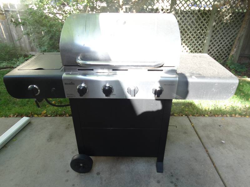 lot 199 image: Charbroil propane grill w side burner- Includes propane tank