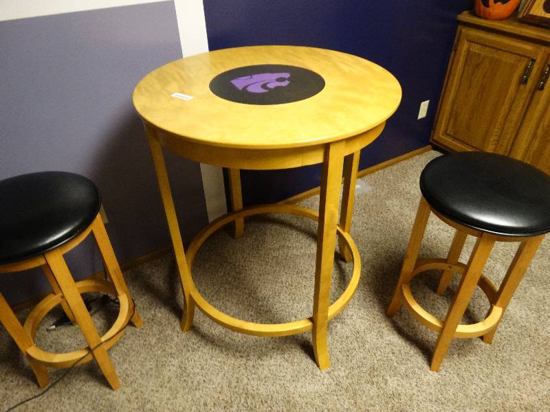 lot 271 image: K_State round high table with 2 bar stools. 32 round and 39 tall