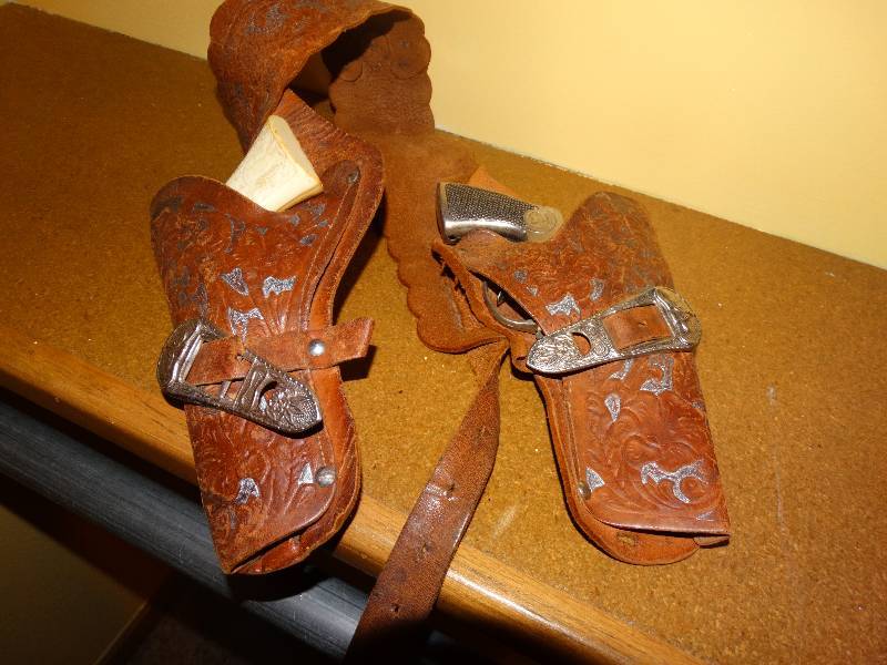 lot 336 image: Antique childs toy guns w belt