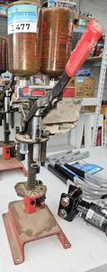 lot 3477 image: MEC Shell Reloading Press with Powder Bottles