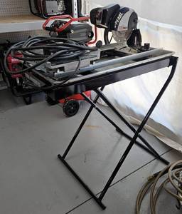 lot 3314 image: Synnova Tile Saw Model 019H27000 with Stand - 115V AC Power, 60Hz, 8.5A Motor Running at 6,000 RPM. Includes Folding Stand with Wheels. Water System