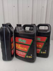 lot 3573 image: Lot of 3 - 2 Full Unopened and One Partial - Two OReilly AW-32 Hydraulic Oil 1 Gallon Containers One Full Unopened and One with 1L Remaining - One Unopened AW-46 Hydraulic Oil