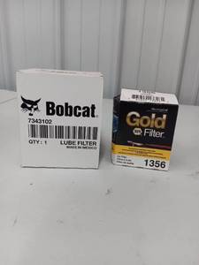 lot 3576 image: Lot of 2 - New Bobcat Lube Filter 7343102 and NAPA Gold 1356 Oil Filter