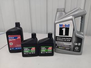 lot 3581 image: Lot of 4 - 3 PARTIALLY USED and 1 Full Motor Oil Lot - Mobil 1 5W-30 is 34 Full -  ACE Multi-Grade Oil is Full Qt Bottle - Ace 4 Cycle Oil is about 34 and 12 Full