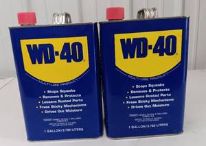 lot 3584 image: Two - WD-40 Multi-Use Product 1 Gallon Cans - Set of 2 -1 Full and 1 Partial about Half Full