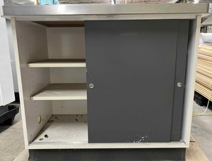 lot 3644 image: White Shelved Storage Cabinet with Sliding Doors and Stainless Steel Top 39x24x34in