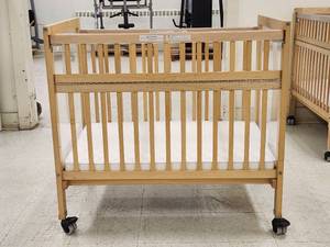 lot 3081 image: Whitney Brothers Commercial Wooden Baby Crib with Mattress and Casters