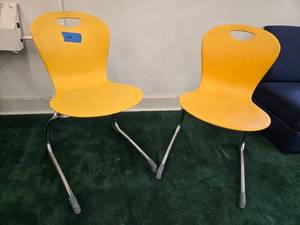 lot 9045 image: (2) Modern Yellow Plastic Stack Chairs with Chrome Base