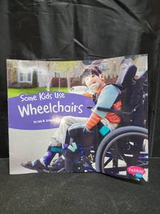 lot 2021 image: Some Kids Use Wheelchairs - (Understanding Differences) by Lola M Schaefer (Paperback)