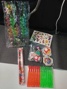 lot 2263 image: Super Mario Party Favors, 106 pieces-keychains, stickers, bubbles, slap bracelets, tattoos & crazy straws