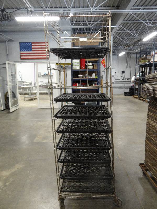 lot 2212 image: Rack with (11) Racks On Casters, 8 Black Trays