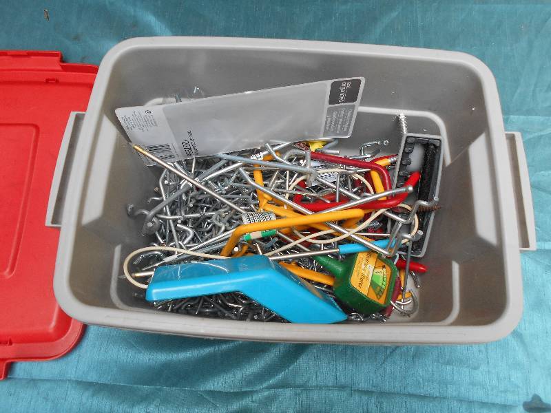 lot 8141 image: Tote of Peg Board Pegs and more