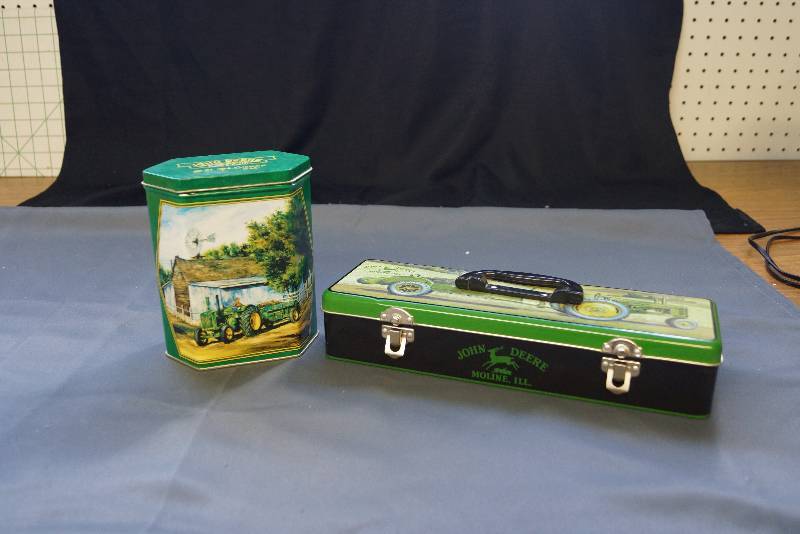 lot 104 image: 2 John Deere Tins