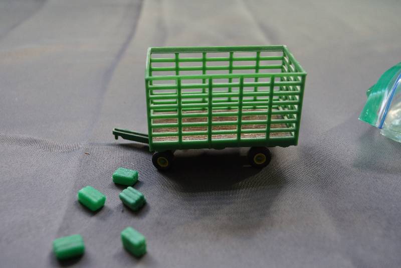 lot 120 image: John Deere Little Hay Trailer and Mini Bales