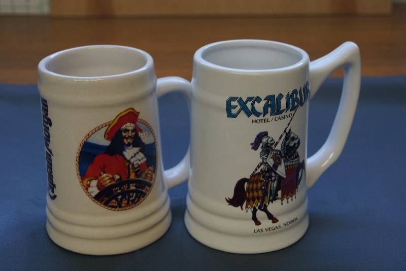 lot 209 image: Pair of Beer Steins  Captain Morgan and Excaliber