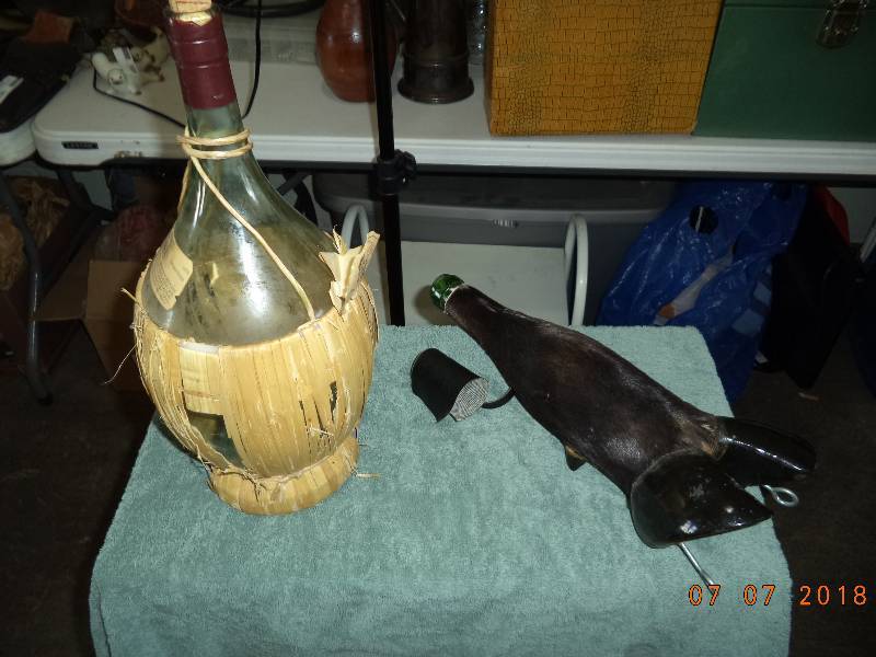 lot 1853 image: Wine Bottle Holders- ONE IS A HOOF and LEG 