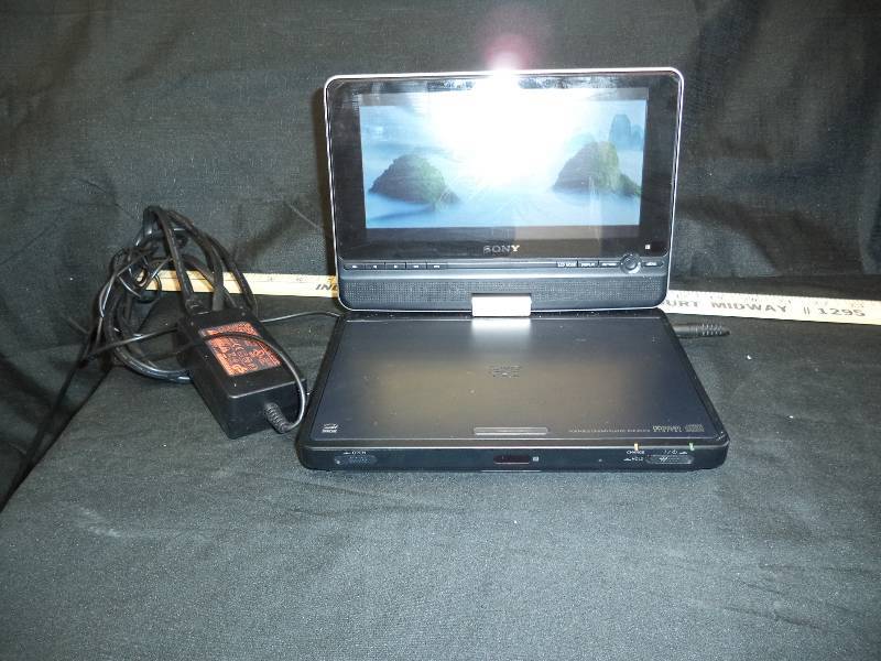 lot 1977 image: Portable DVD Player and 5 Kid DVDs
