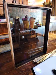 lot 9226 image: Glass Panned Dark Widow With Wood Frame