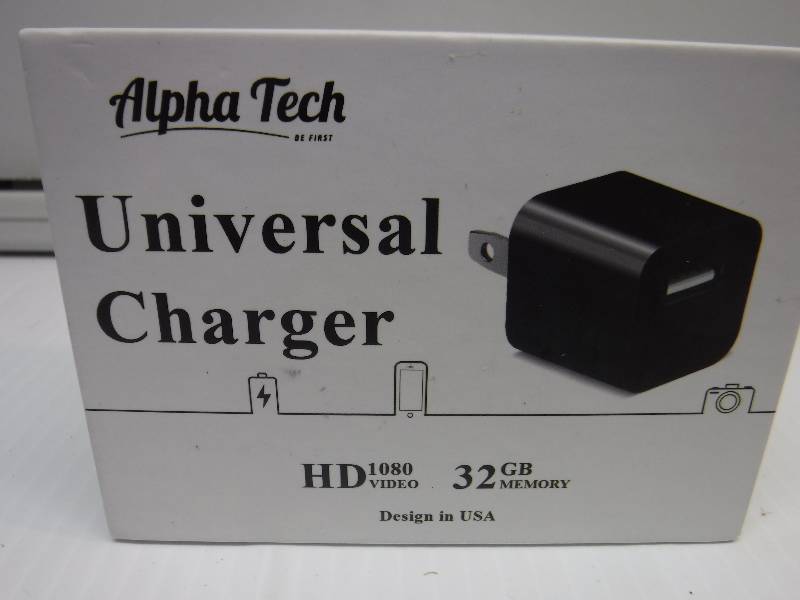 lot 1174 image: alpha tech hidden spy camera and charger