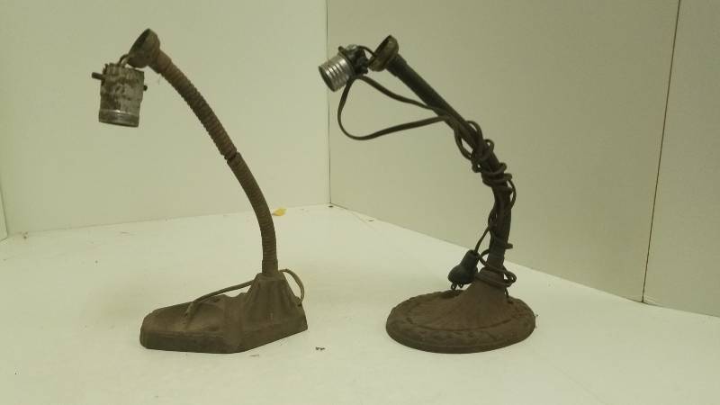 lot 1271 image: 2 Very old, iron base desk lamp stands, ornate