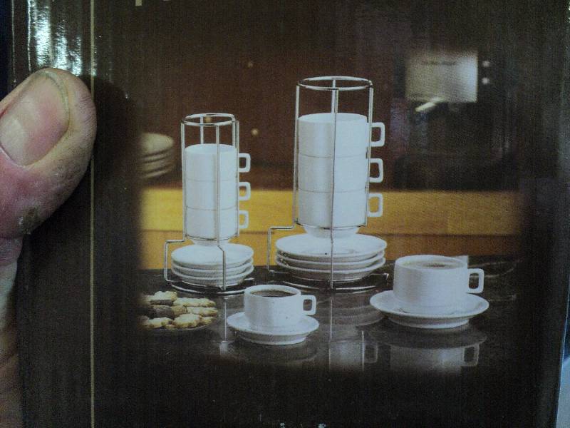lot 1014 image: Demi cup and saucer set,  includes (4) 4 ounce cups with matching saucers and chrome rack