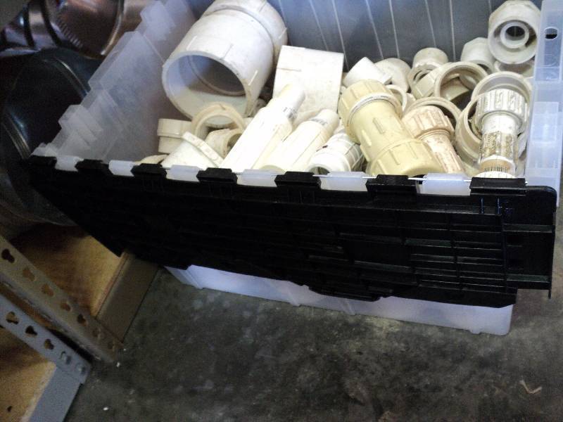 lot 1039 image: plastic tote PVC plumbing fittings,  assorted sizes and styles